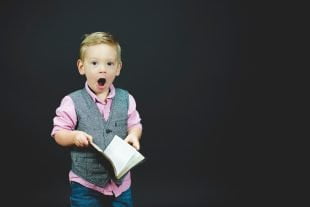 A young boy with an expression of surprise when he realises that glass walk or fire walk is not really about mind power