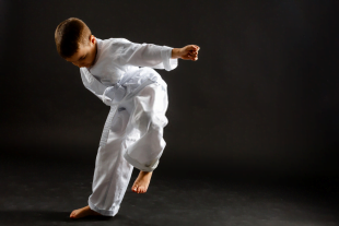 A boy turning weakness into strength by regularly practicing karate