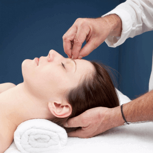 Therapist using massage to induce hypnotic state to help client experience pain relief