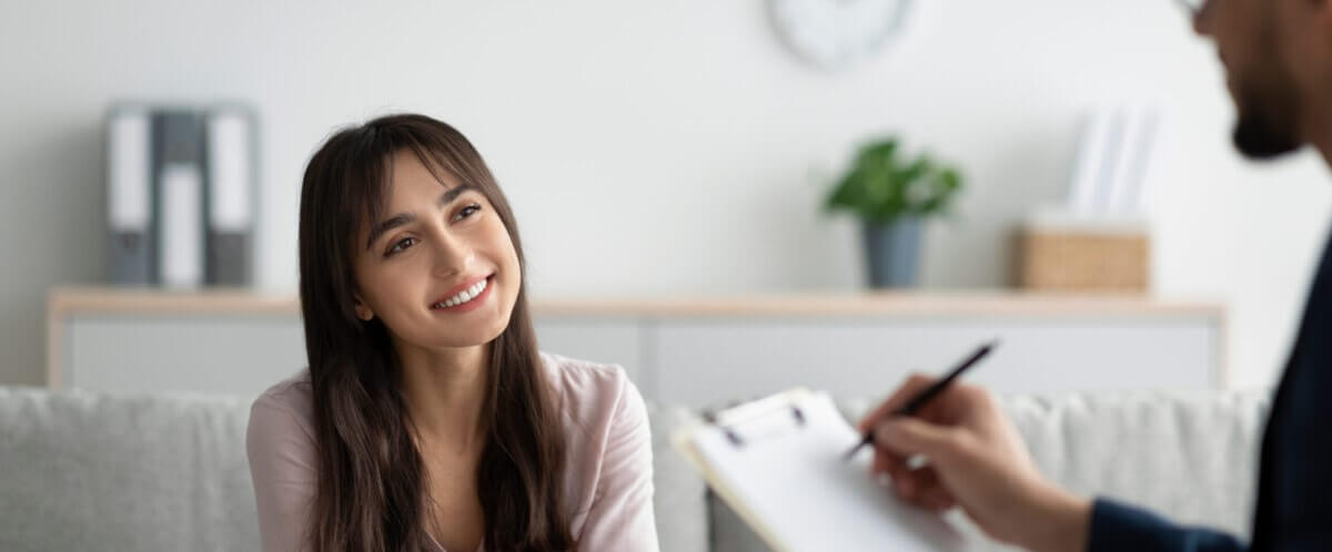 young woman feeling better after seeking help via stress management coaching